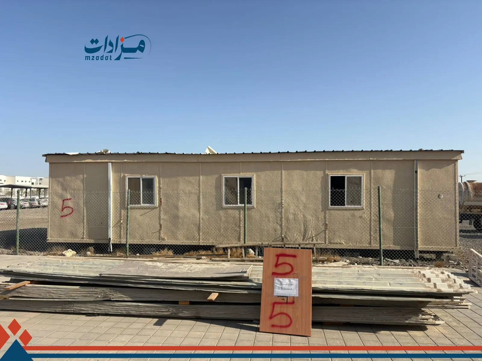 5- Mobile housing unit, garbage containers, and sheet metal - 4