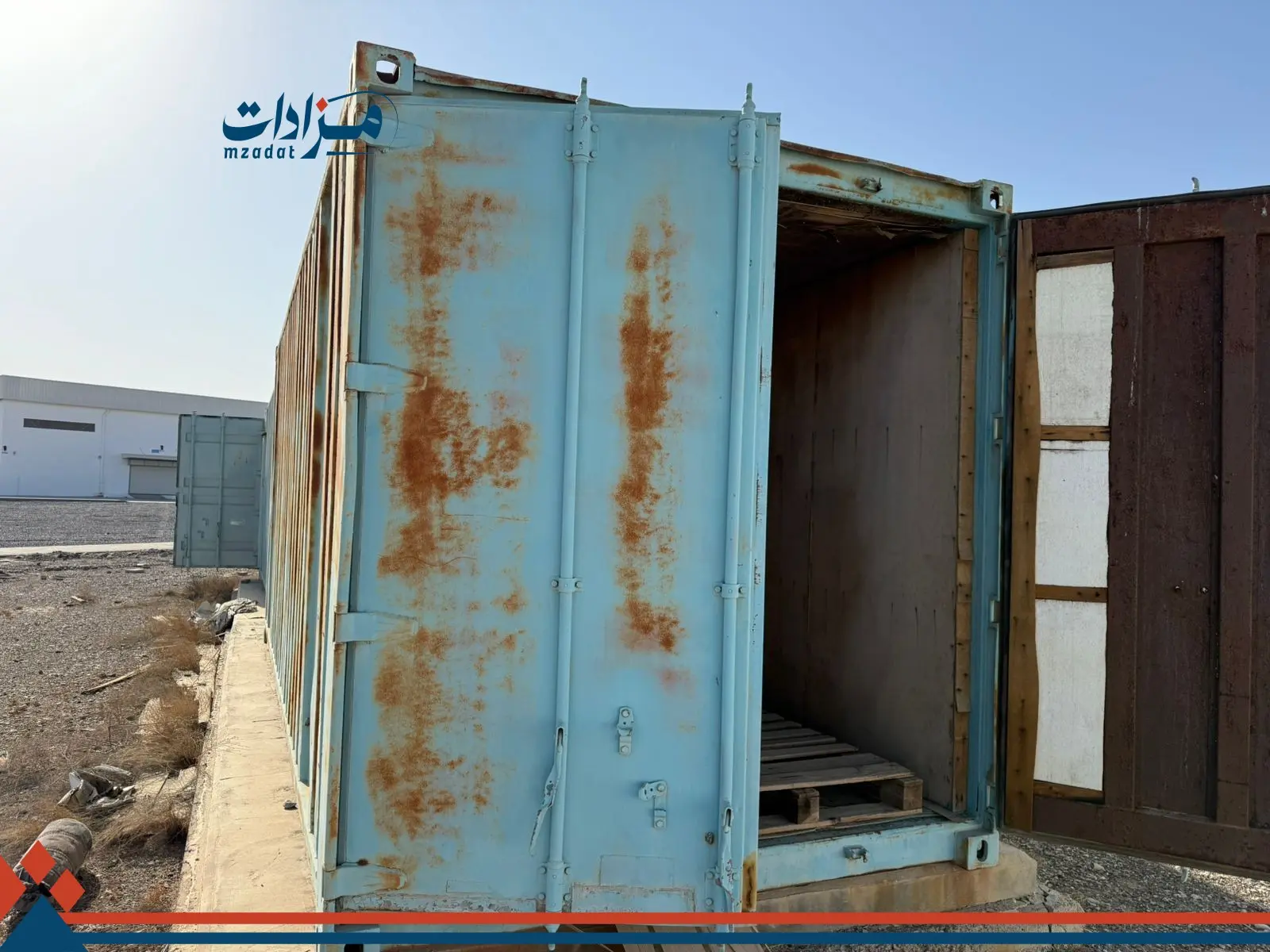 5- Mobile housing unit, garbage containers, and sheet metal - 11